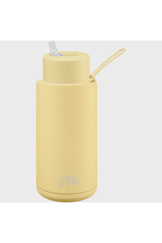 Frank Green Ceramic Reusable 34oz Water Bottle in Buttermilk Pale Yellow Side View showing Mouth Sipper standing Up