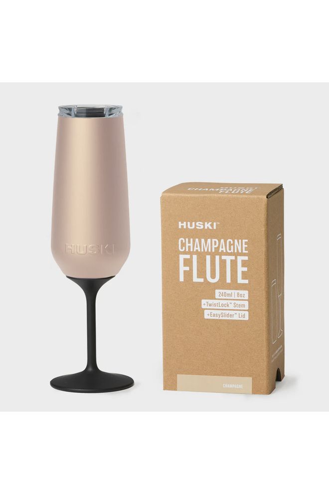 Huski Champagne Flute in Champagne Colourway displayed next to gift box