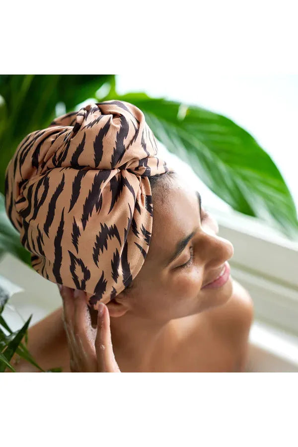 Dock & Bay 100% Recycled Hair Wrap or Hair Towel Fierce Tiger neutral background with black tiger stripes. Model in bath  wearing Hair Wrap.