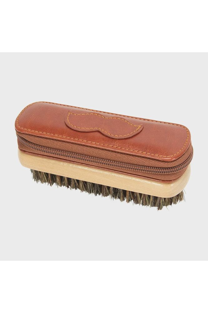 Annabel Trends Gentlemen's Beard Grooming Kit. Image showing the Vegan leather zipped upper compartment attached to a brush on the underside.