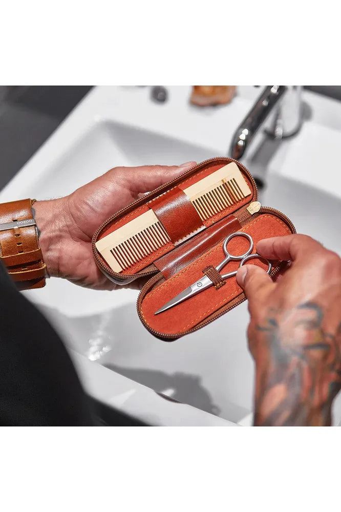 Annabel Trends Gentlemens Beard Grooming Kit contained in a vegan leather case.  Image shows case open showing a comb and trimming scissors.