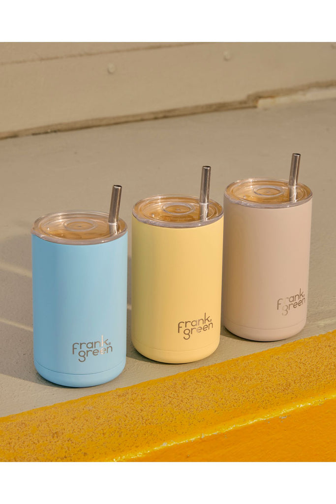 Three insulated cups with straws from Frank Green on a neutral background