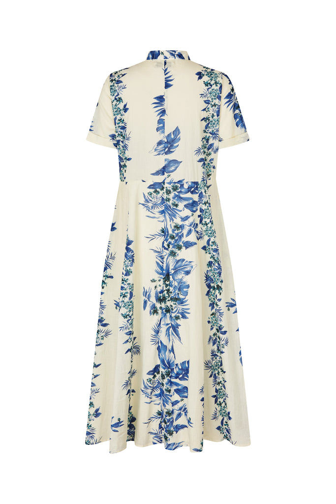 White dress with blue floral pattern on a white background