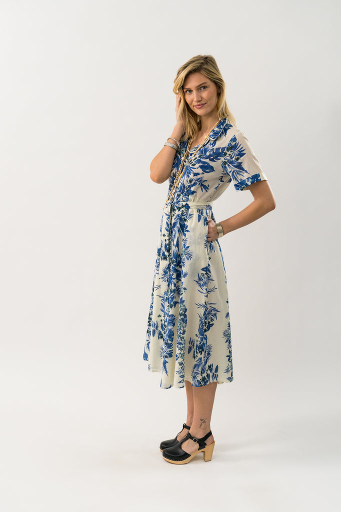 Woman wearing a floral dress on a white background