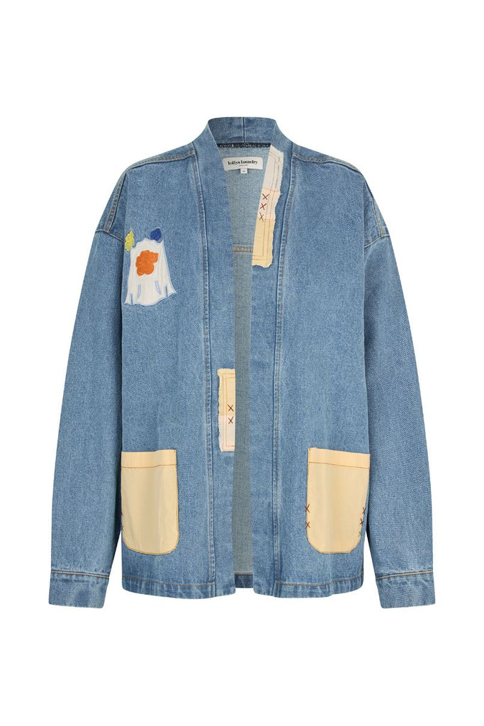 Blue denim jacket with patch details on a white background. Lollys Laundry Mila Jacket washed denim.