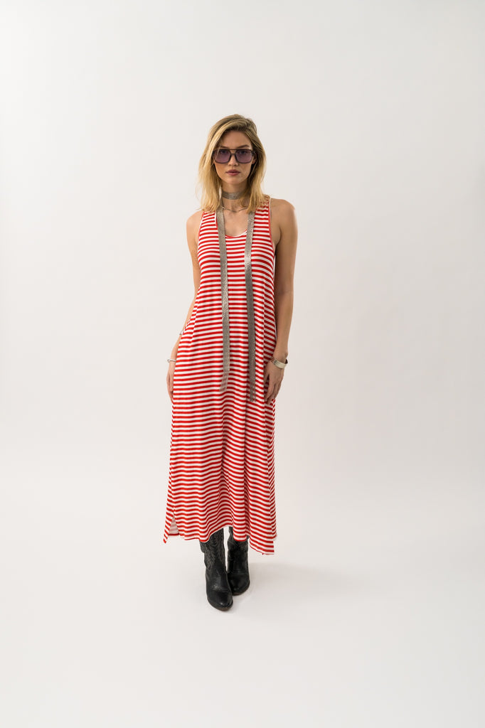 Woman wearing a red and white striped dress on a white background. Lollys Laundry Myla Maxi dress in red stripe.