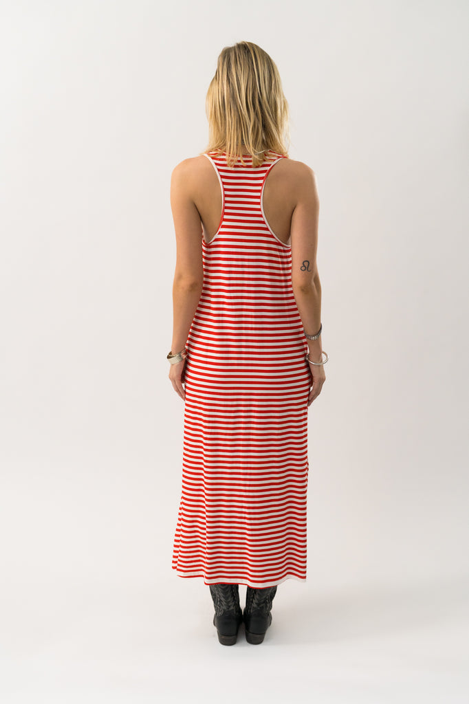 Woman wearing a red and white striped dress on a white background. Lollys Laundry Myla Maxi dress in red stripe.