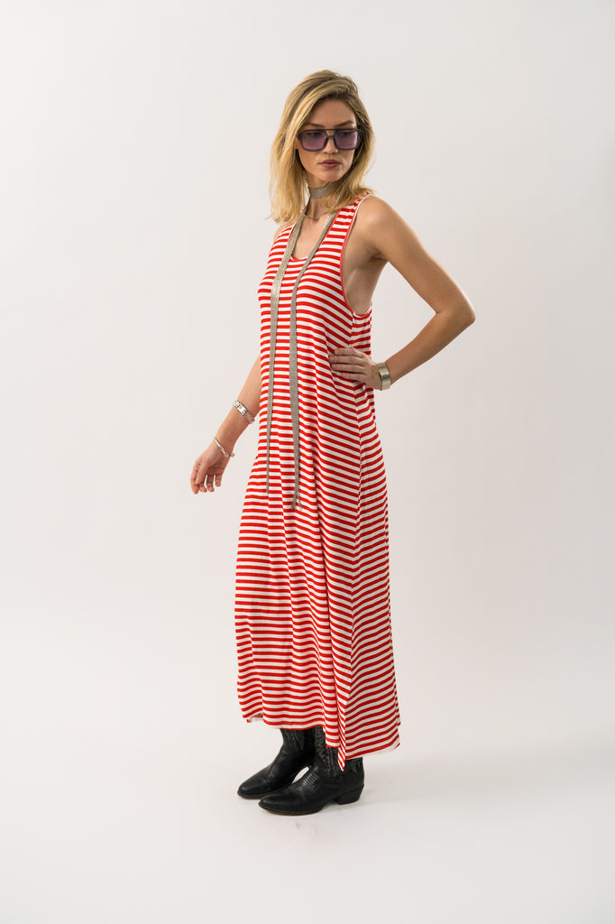 Woman wearing a red and white striped dress on a white background. Lollys Laundry Myla Maxi dress in red stripe.