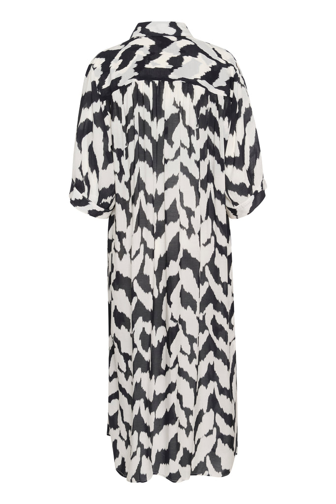 Black and white patterned dress on a plain background. Saint Tropez Kelsie Shirt dress in black and white.