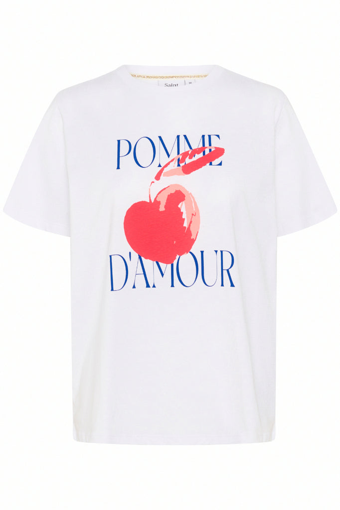 White t-shirt with a red apple graphic and 'Pomme d'Amour' text on a white background. Saint Tropez Harda Tee in white.