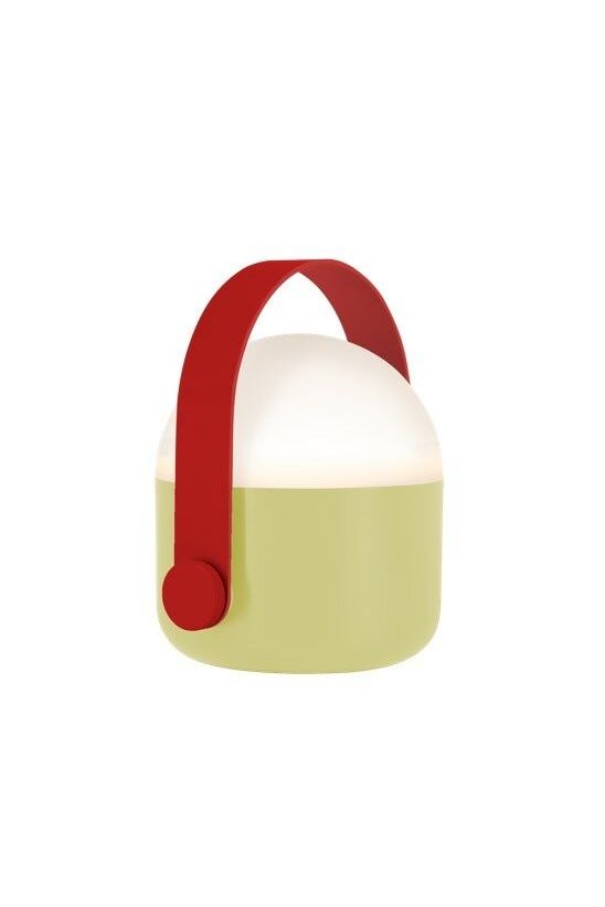Sand-coloured Remember Ole portable LED lamp with a red handle, glowing softly in warm white light on a flat surface.