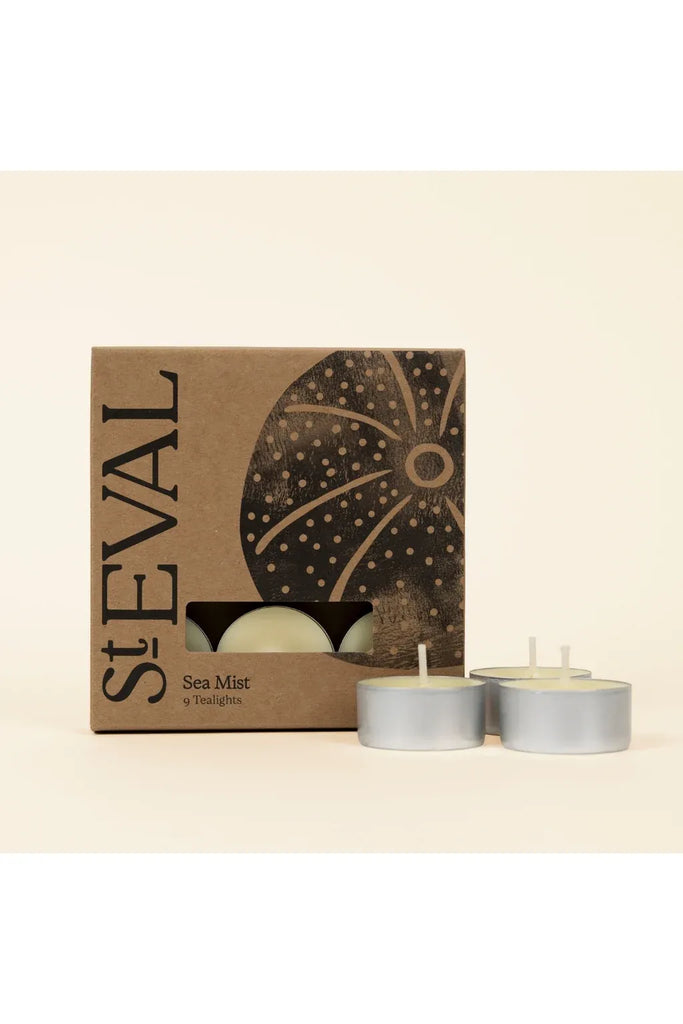 St Eval Sea Mist fragranced tealights with packaging on a beige background.