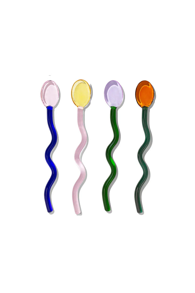 Four Multicoloured wavy Sucker Cocktail Stirrers  on a white background