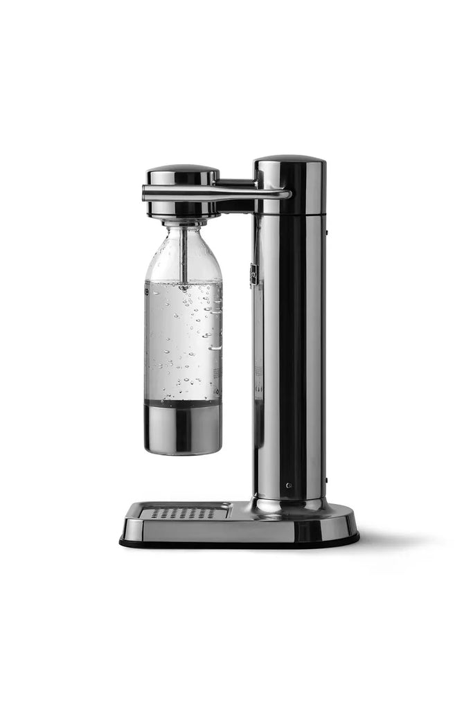 Arake Carbonator soda machine with bottle on a white background.