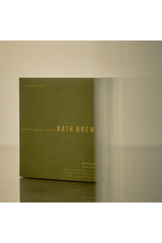 Addition Studio Giant Tea Bag for the Bath Brew. Green packaging with 'Bath Brew' text on a beige background
