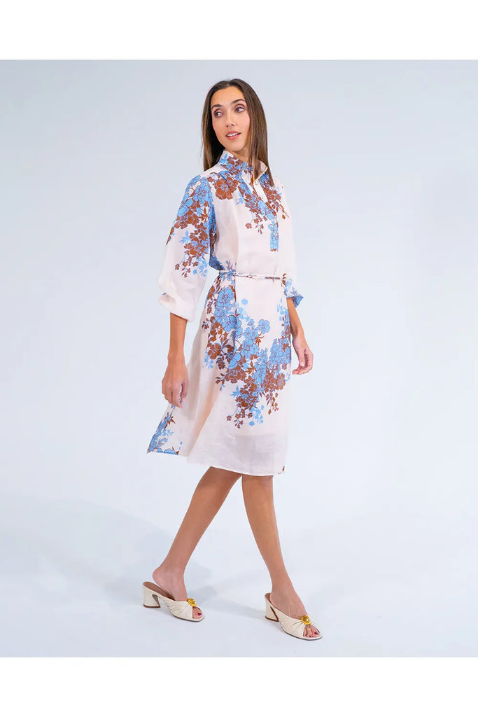 Woman wearing a floral dress on a white background. Arlington Milne Emerson Dress in Wisley Floral.