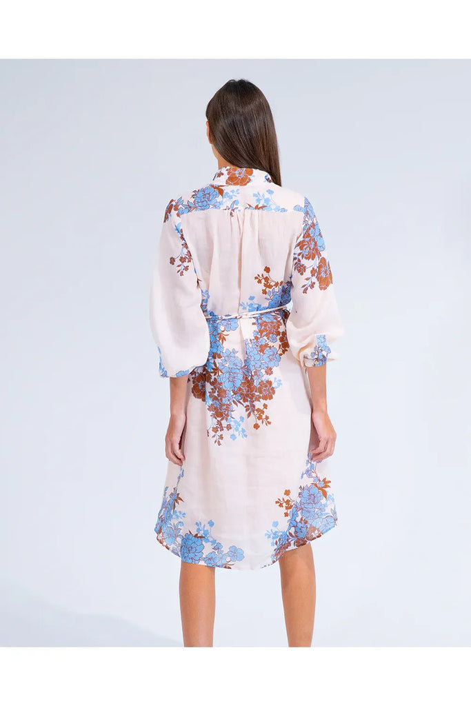 Woman wearing a floral dress on a white background. Arlington Milne Emerson Dress in Wisley Floral.