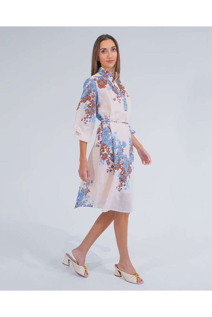 Woman wearing a floral dress on a white background. Arlington Milne Emerson Dress in Wisley Floral.