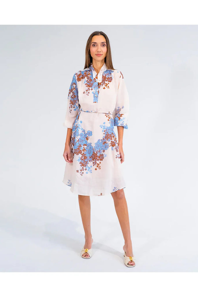 Woman wearing a floral dress on a white background. Arlington Milne Emerson Dress in Wisley Floral.