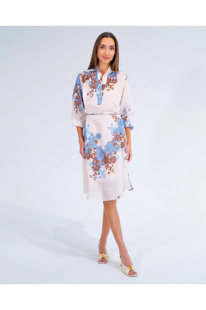 Woman wearing a floral dress on a white background. Arlington Milne Emerson Dress in Wisley Floral.
