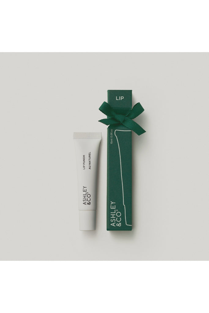 Ashley & Co Forest Collection Lip Punch Au Natural Lip balm with green packaging and bow on a light grey background