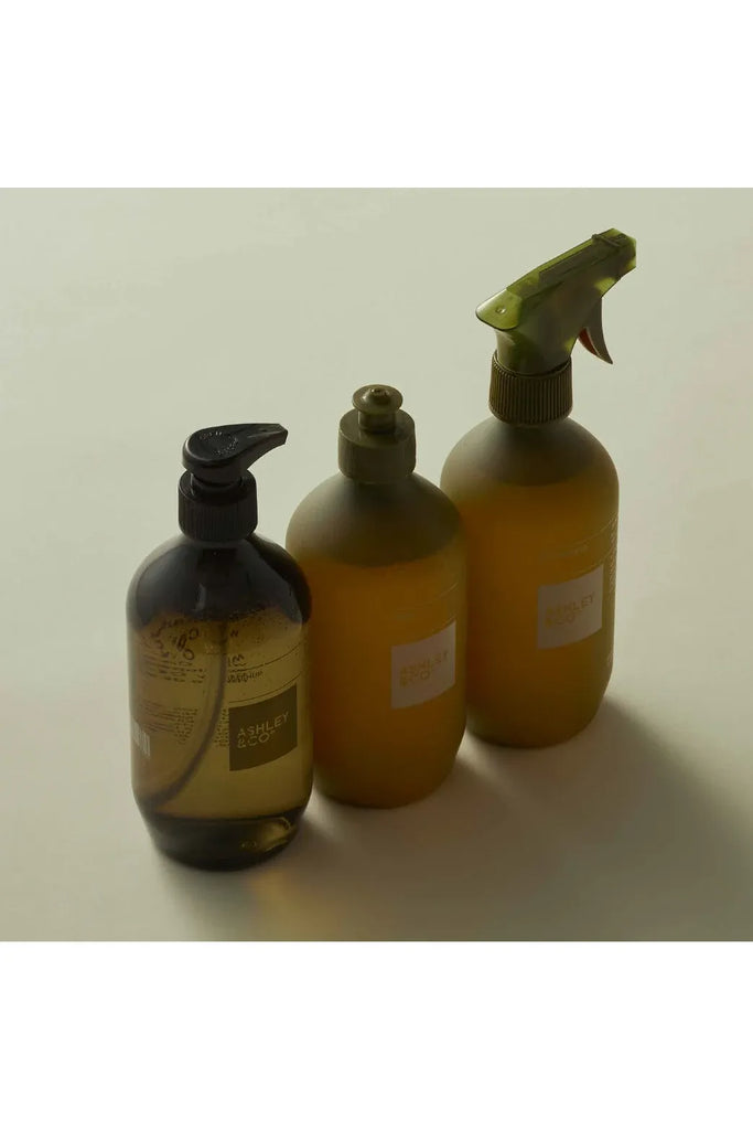 Ashley & Co's Lotus Leaf and Lustre Range of Products, a Handwash, Dishwashing detergent and bench spray. Three bottles with different dispensers on a light background.