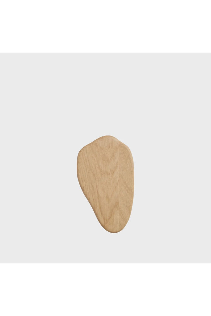 Broste Natural Medium Limfjord Choppiing Board. Board standing upright on a light grey background.