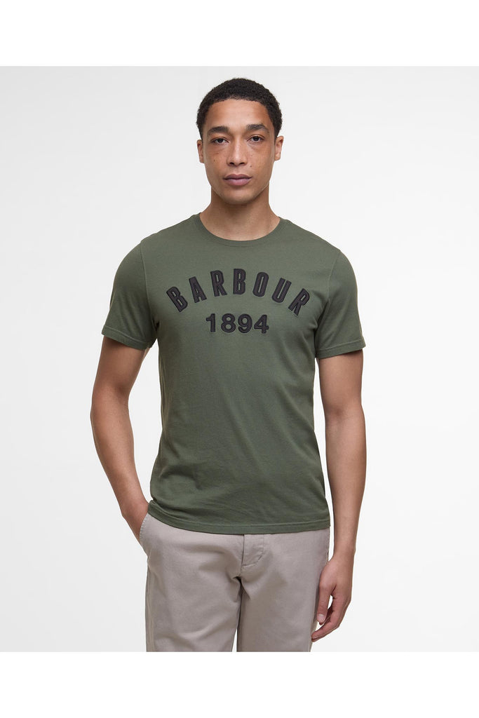 Man wearing a green Barbour t-shirt with 'Barbour 1894' text on a white background