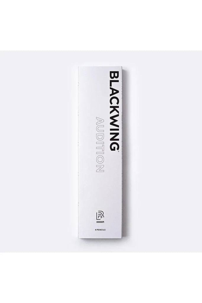 Blackwing Audition Pack. Set of 4. Image shows exterior of white presentation box. Text on box running vertically down the long side of the box read BLACKWING AUDITION. Text running horizontally along the short side of the box reads Pencils shown inside the presentation box reads 4 Pencils.