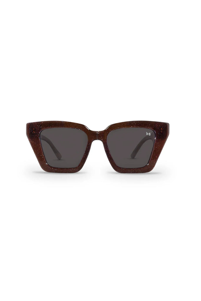 Sunglasses with brown frame and dark lenses on a white background. Bored George Piper Sunglasses in Shimmer.