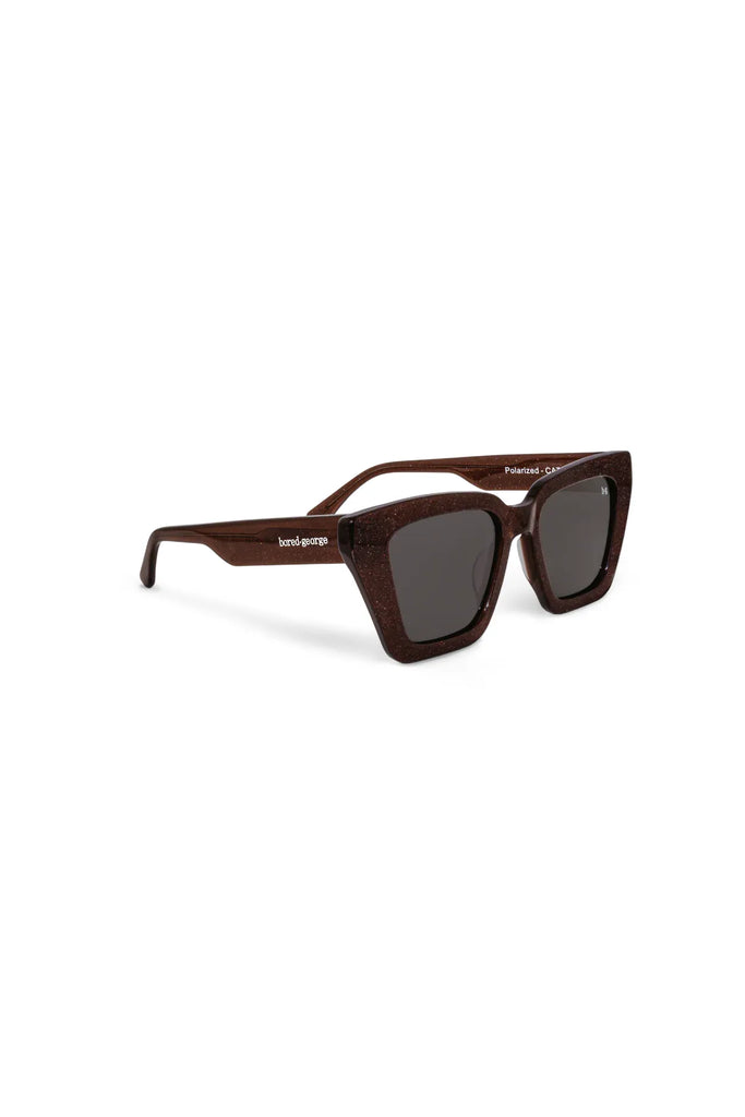 Brown sunglasses with a brand logo on a white background. Bored George Piper Sunglasses in Shimmer.