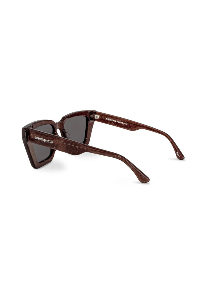 Brown sunglasses with a brand logo on a white background. Bored George Piper Sunglasses in Shimmer.