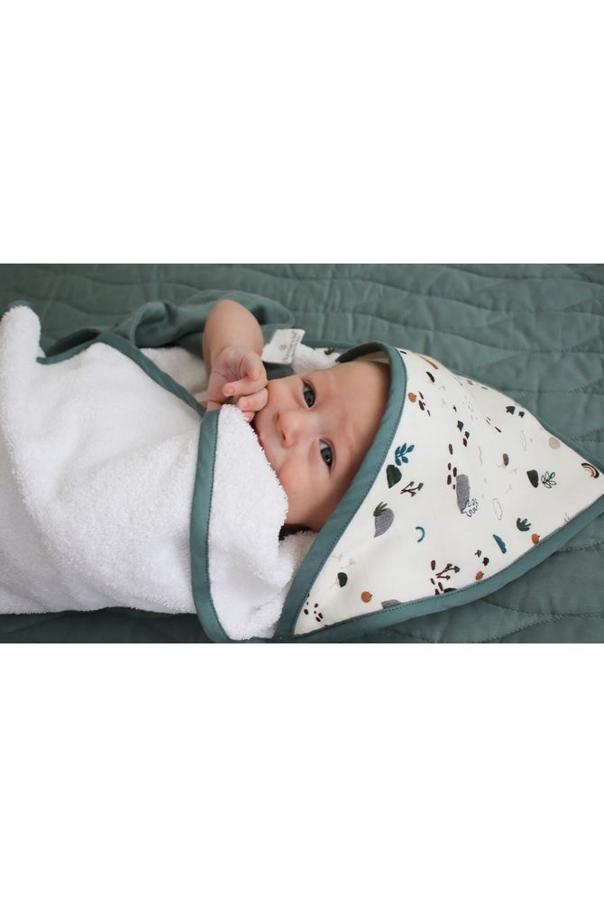 Burrow_Be_Garden_Treasures_Hooded_Towel. Image shows baby snuggled up in the hooded towel .
