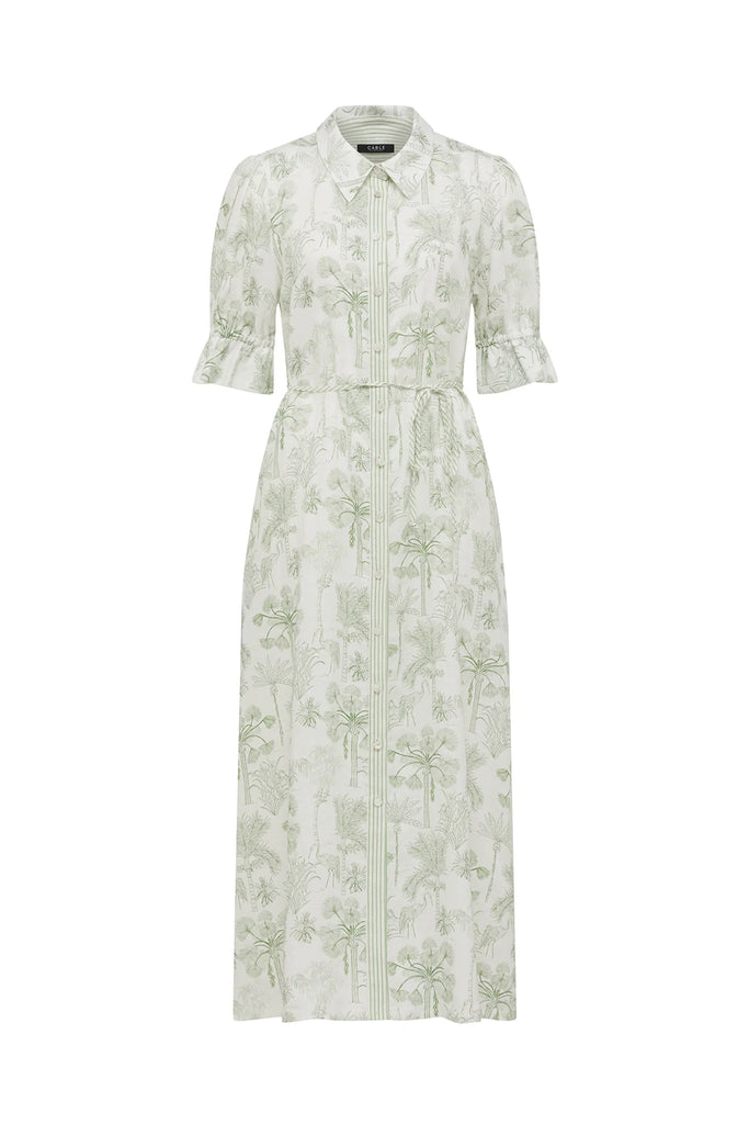 Woman wearing a light-colored dress with a subtle pattern on a plain background. Cable Melbourne Avondale Linen Dress in Palm Print.