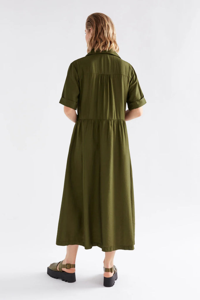 Woman wearing an Elk Eine shirt dress in Olive with a white background