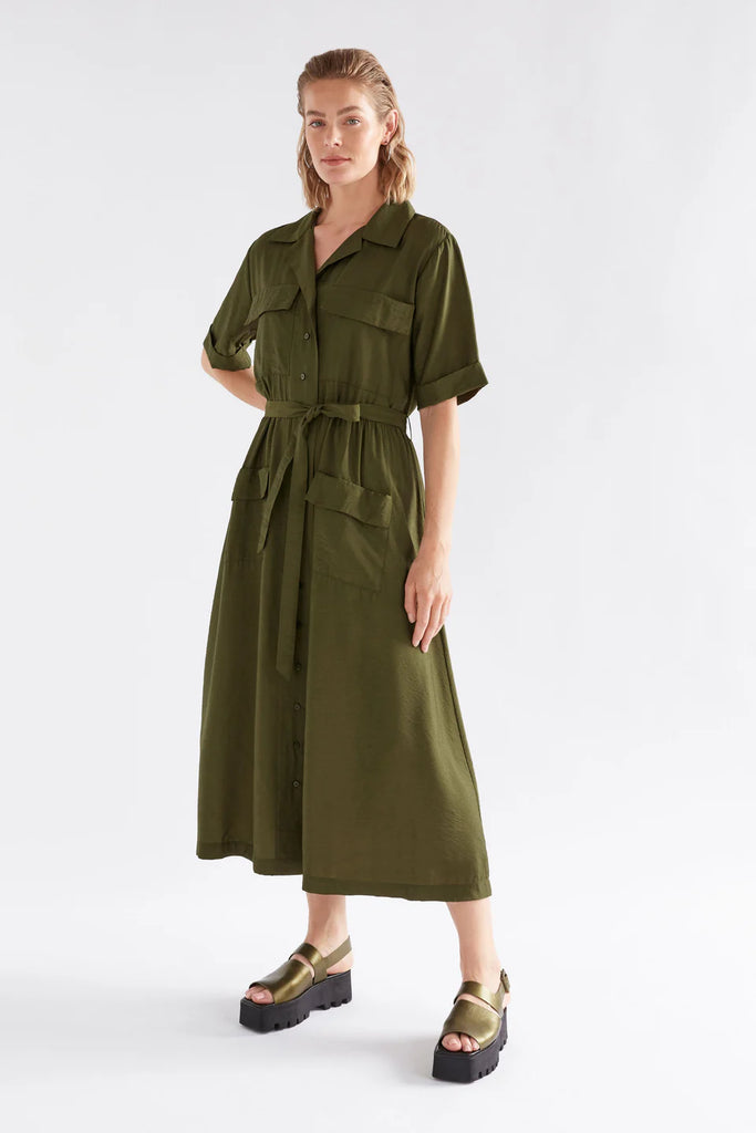 Woman wearing an Elk Eine shirt dress in Olive with a white background