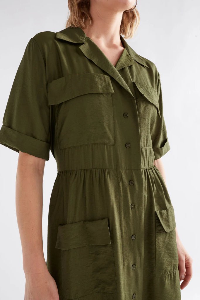 Woman wearing an Elk Eine shirt dress in Olive with a white background