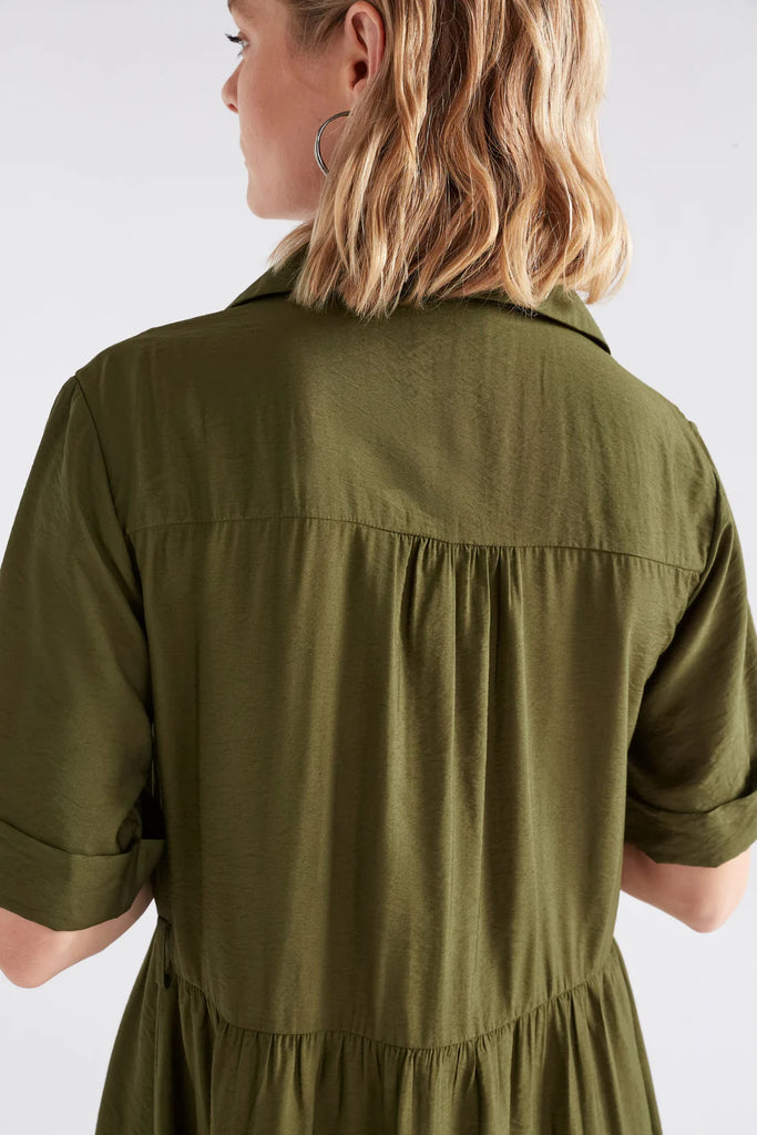 Woman wearing an Elk Eine shirt dress in Olive with a white background