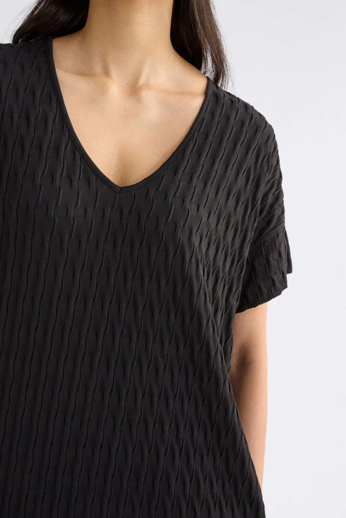 Woman wearing a black dress on a white background. Elk Orta Dress Black,