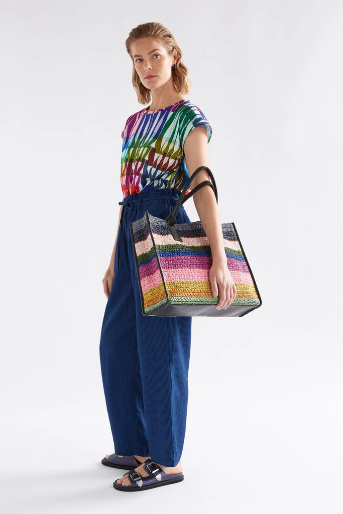 Multicolored striped handbag with black handle. Elk Vavda Tote Kalla Print