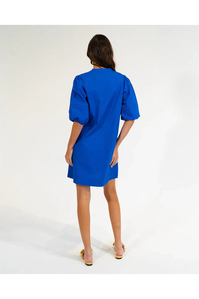 Woman wearing a cobalt blue dress on a white background. Elms & King Monterey Mini Dress in Cobalt Blue.