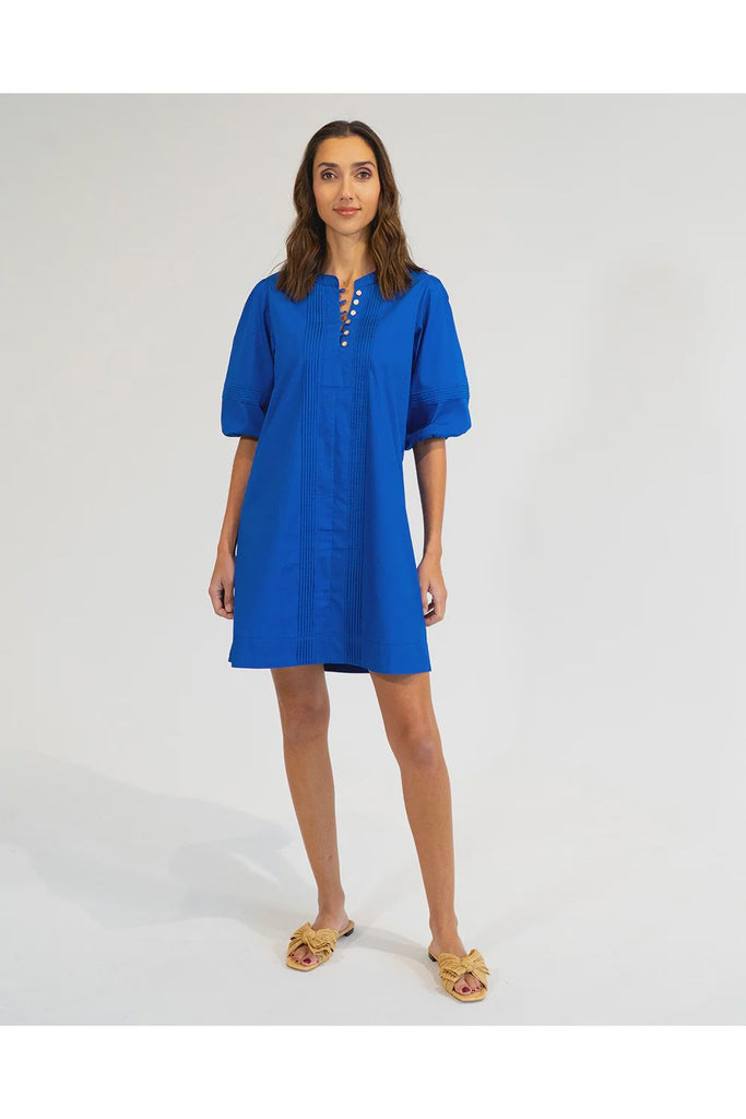 Woman wearing a cobalt blue dress on a white background. Elms & King Monterey Mini Dress in Cobalt Blue.