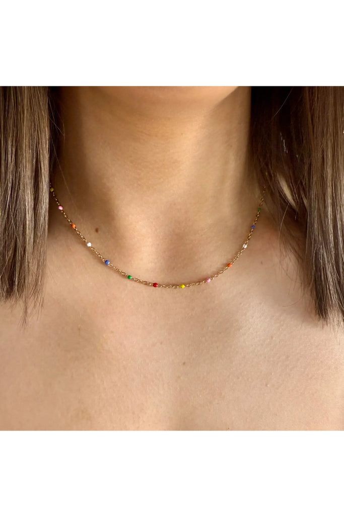 Necklace with multicolored beads worn by a person with shoulder-length hair. Ever Colour Wave Necklace.
