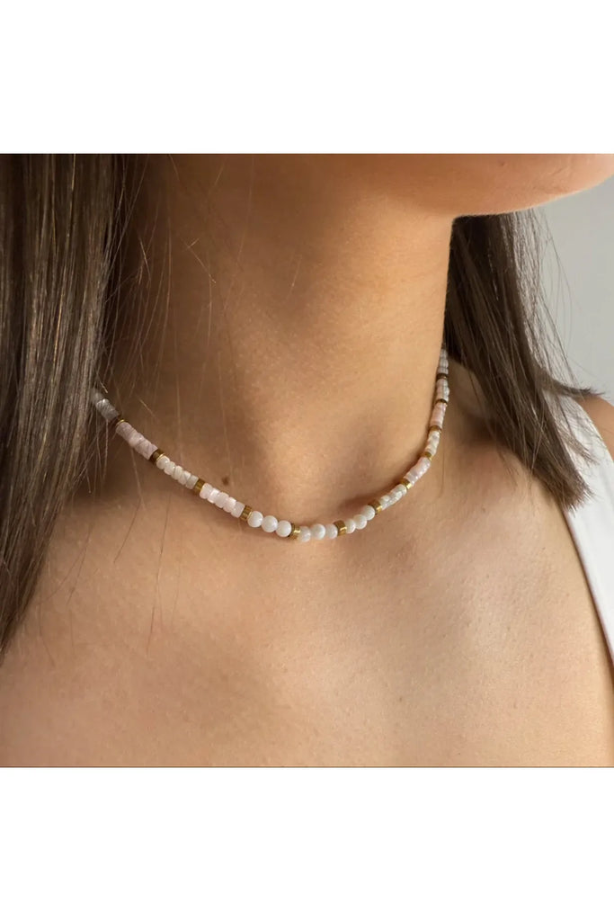 Beaded necklace worn by a person with a neutral background. Ever Horizon Beaded Necklace.