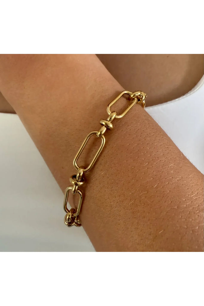 Ever Signal Chain Bracelet in Gold on wrist on white background