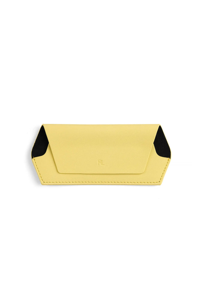 Yellow glasses case with black interior on a white background