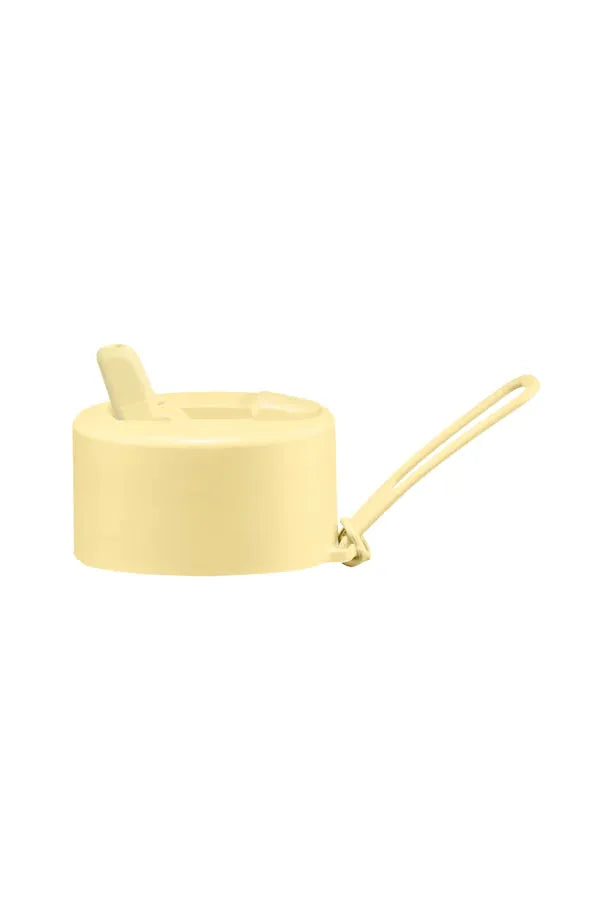 Frank Green Flip Straw Lid Hull in Buttermilk Pale YellowSide View showing sipper standing upright and Slide Button