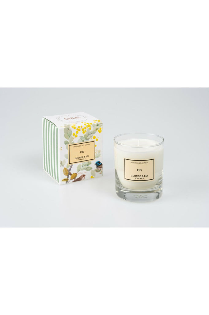 Standard Size George & Edi Fig Candle sitting in front of its Floral signature packing box.