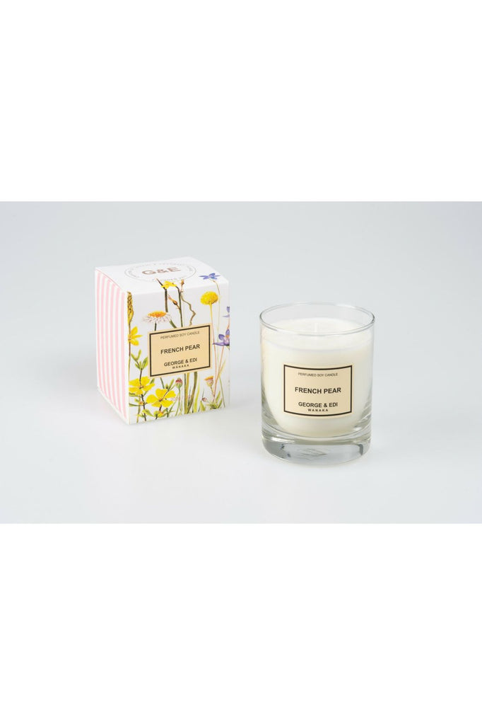 Standard Size George & Edi French Pear Candle sitting in front of its Floral signature packing box.