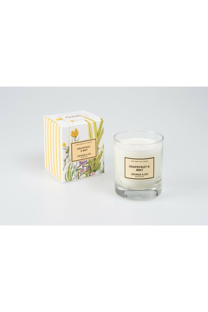 Standard Size George & Edi Grapefruit & Mint Candle sitting in front of its Floral signature packing box.